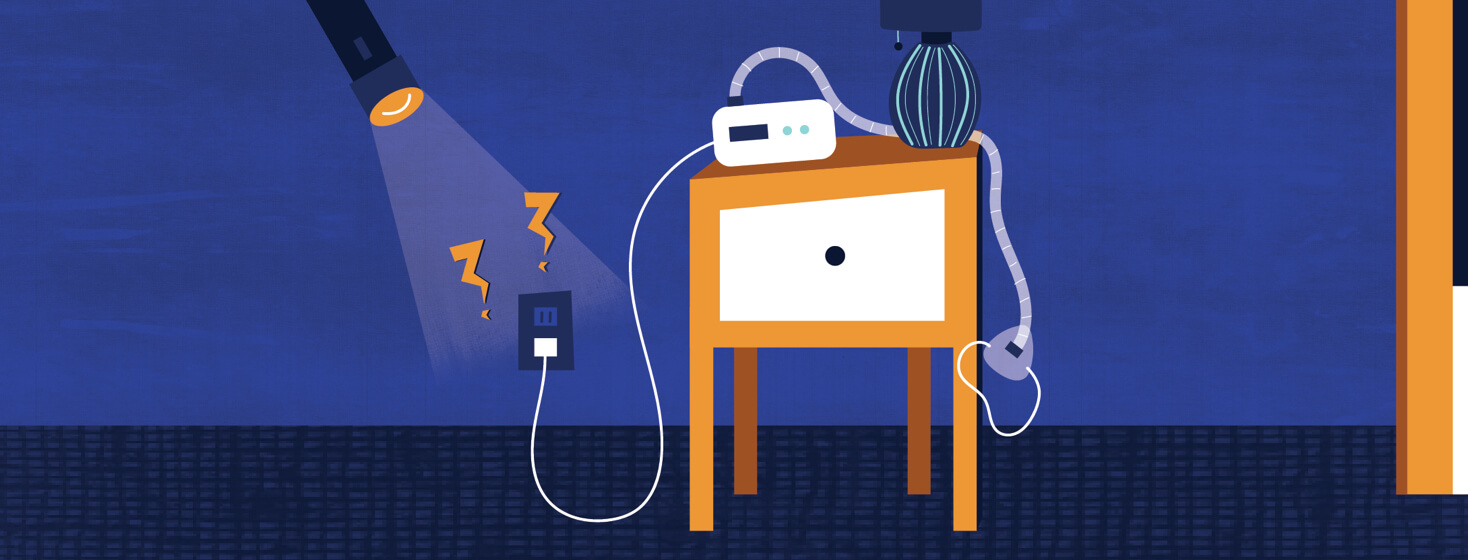 a dark room with a CPAP machine plugged in and a flashlight shining on the CPAP plugged into an outlet with power bolts in the shape of exclamation points