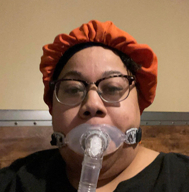 Advocate Brittany Washington wearing an oral-only CPAP mask.