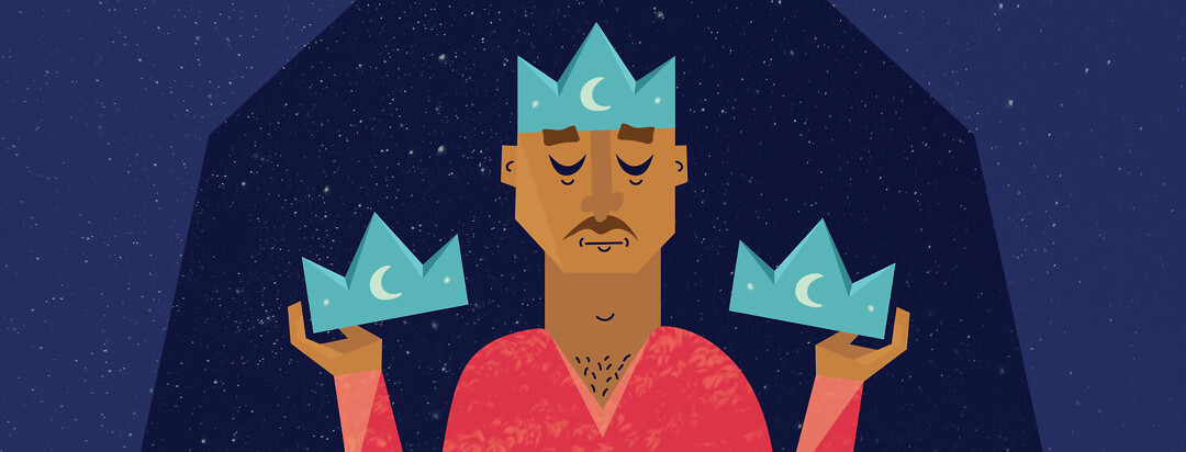 a man wearing a crown and holding two other crowns all with moons on them