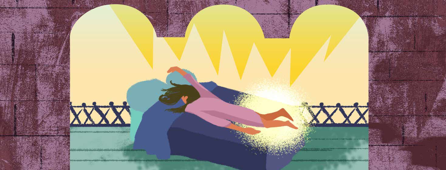 A woman lying face-down on a bed with an arm slung up and over the pillow, and a glowing bright aura around her legs.