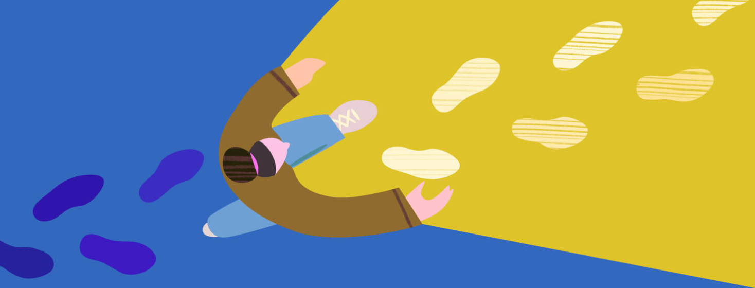 Woman walking forward and illuminating the path in front of her