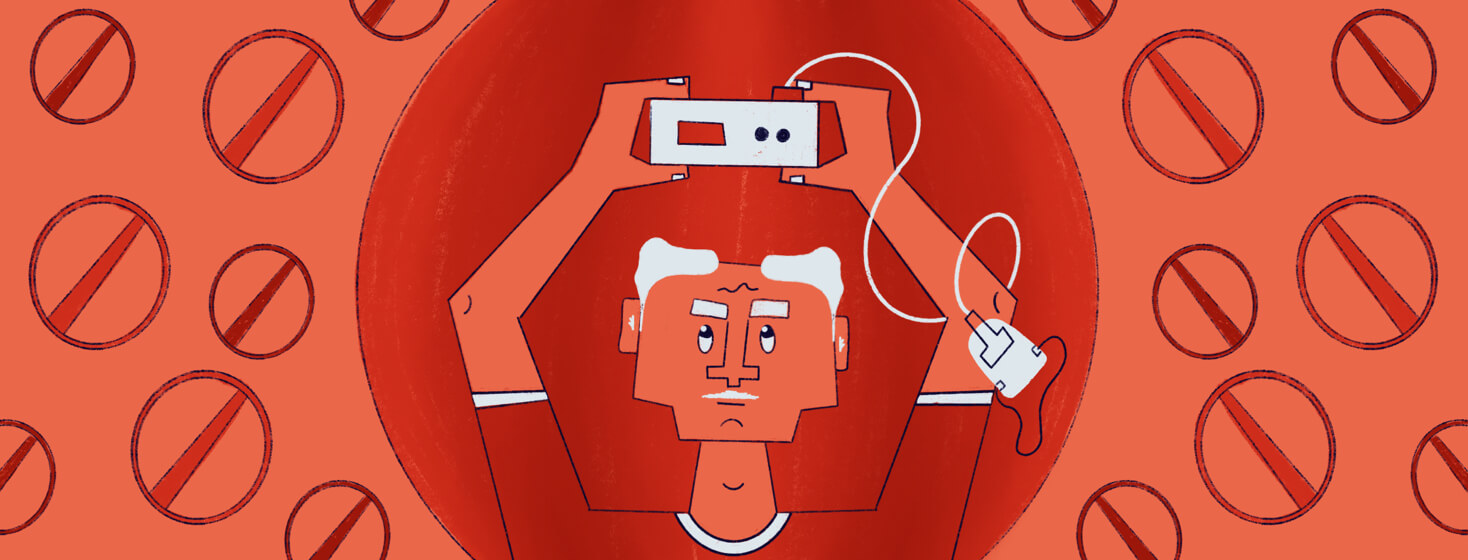 a man holding a CPAP machine over his head with red no signs around him