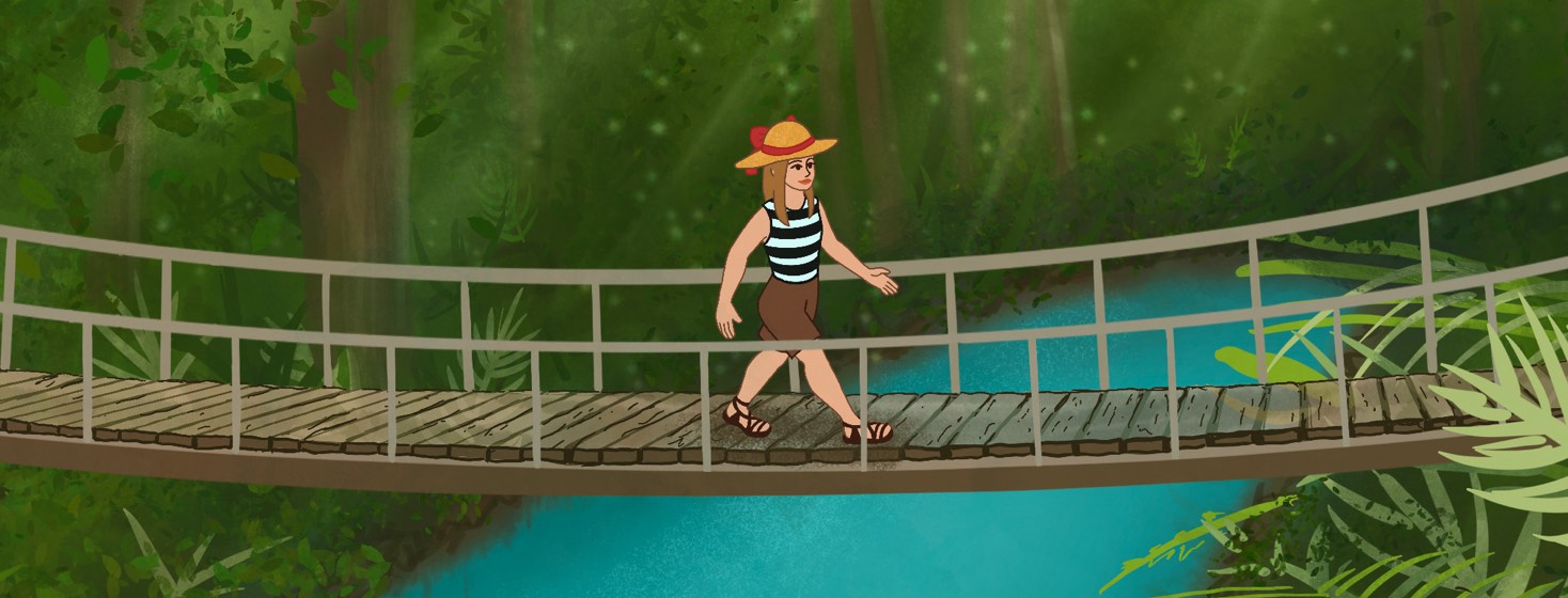 A woman in a large floppy hat walking across a wood plank bridge over a bright blue river in a rainforest.